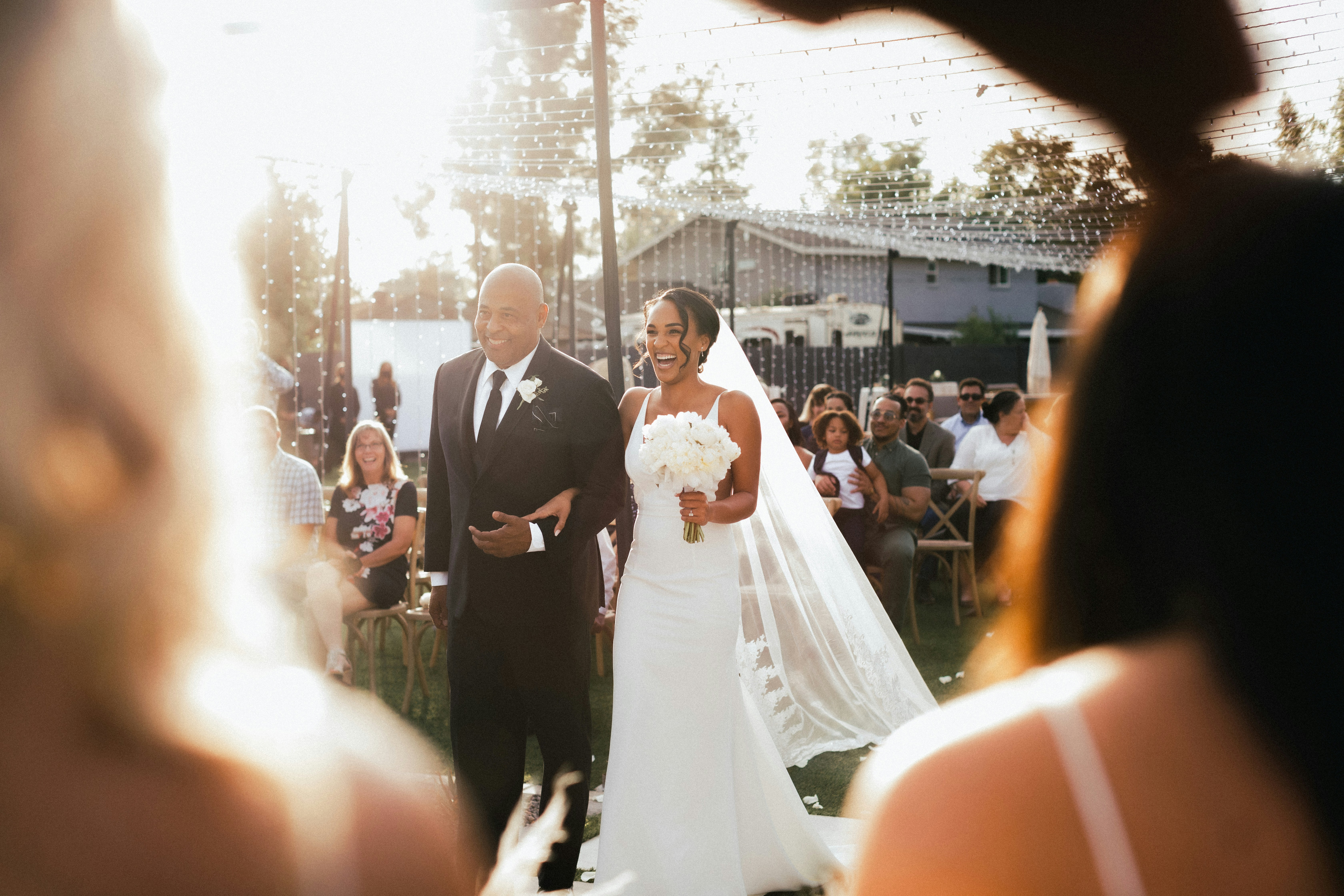 Bride and groom standing on a street during daytime